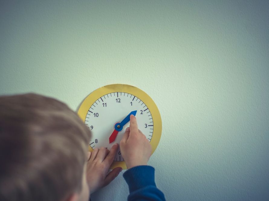 Boy with play clock for adjust