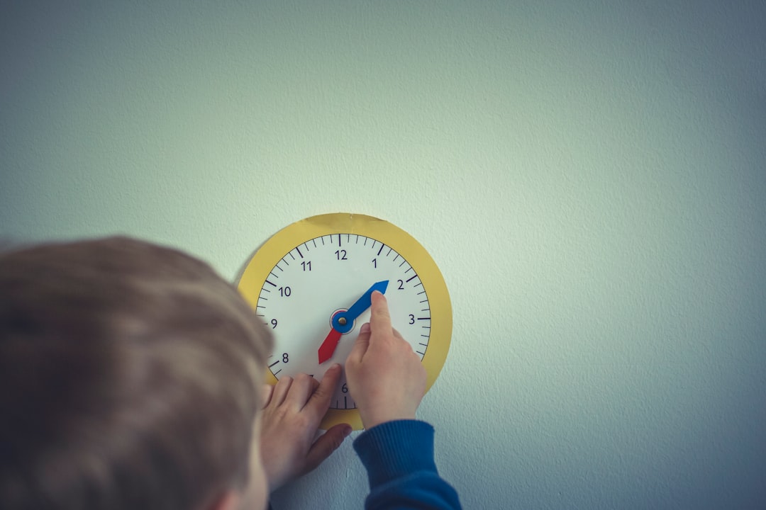 Boy with play clock for adjust