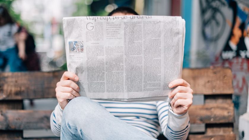 Person reading a newspaper